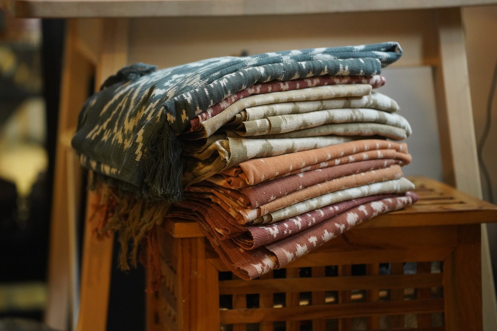A stack of folded handwoven ikat cloths
